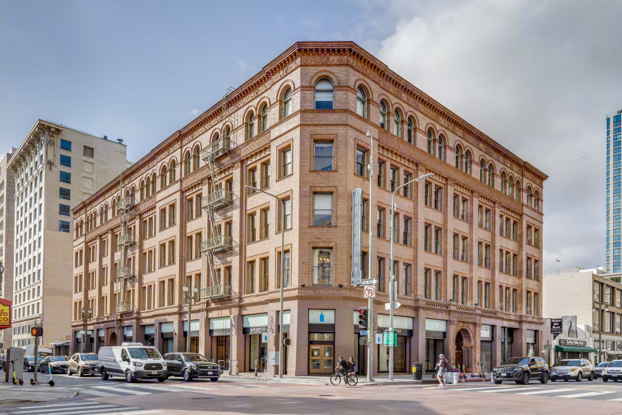 Beautiful view of Bradbury Building showcasing its ornate ironwork, open cage elevators, and skylight